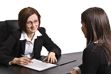 a human resources staffer interviewing a prospective employee